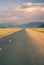 Beautiful Mongolian Road with tarmac with a grey sky and white clouds