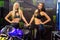 Beautiful Monster Energy girls pose with the motorcycle at Belgrade Car and Motor Show