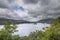 Beautiful moody landscape image of view from Surprise View viewpoint in the Lake District overlooking Derwentwater with Skiddaw