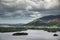 Beautiful moody landscape image of view from Surprise View viewpoint in the Lake District overlooking Derwentwater with Skiddaw