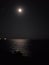 Beautiful moonlight above sea and coast of Ukraine