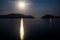 Beautiful moonlit path at night on the sea. Calm sea. Bright moon.