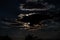 Beautiful moonlit sky with clouds. Night at twilight