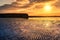 Beautiful morning coastal landscape scenery with mountain reflected in water of sandy Silverstrand beach in Galway, Ireland