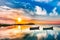 Beautiful morning landscape with boats on the lake anchored to the pier and wood bridges at sunrise