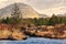 Beautiful morning landscape scenery with river stream and mountains in the background at Derryclare natural reserve in Connemara