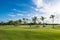 Beautiful morning panorama golf course at sunrise, blue sky