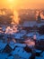 Beautiful morning with sun rising over the Prague roofs covered with fresh snow.