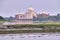 Beautiful morning view of Taj Mahal Palace with Jamuna river in the foreground