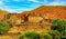 Beautiful moroccan landscape, typical idyllic small clay house village, Central Atlas mountains, Gorges du Dades, Morocco