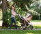 Beautiful Mother Pushing Baby Carriage In Park