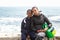 Beautiful mother and son enjoying beach time