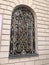 A beautiful motif of wrought iron covers the window of the Gate of Dawn Chapel of Mary the Mother of Mercy in Vilnius, Lithuania.