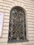 A beautiful motif of wrought iron covers the window of the Gate of Dawn Chapel of Mary the Mother of Mercy in Vilnius, Lithuania.