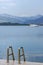 Beautiful motor yacht in the blue sea with mountains in the background. Active recreation and relaxation. Beautiful landscape.