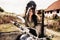 Beautiful motorcycle brunette woman with a classic motorcycle c