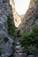 A beautiful mountain gorge with a river and a waterfall