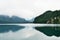 Beautiful mountain lake Alpsee - Hohenschwangau on an early foggy morning. Bavaria, Germany