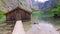 Beautiful mountain lake Obersee with wooden cottage, Alps