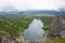 Beautiful mountain lake of turquoise color, top view. The sky is covered with clouds