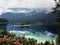 Beautiful mountain landscape of Alpine lake Eibsee, against the backdrop of the mountain Zugspitze covered with fog