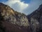 Beautiful mountain landscape with clouds and trees in winter time