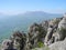 Beautiful mountain landscape with sheer cliffs. Distant mountain plateaus in a blue haze. Crimean mountains