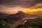 Beautiful mountain landscape during sunrise. Hills, Batur volcano and lake. Scenic panoramic view. Colorful sky with clouds. Foggy