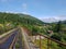 Beautiful mountain narrow-gauge railway road, rails in the mountains of the Carpathians passing through the forest in