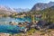 Beautiful mountain nature landscape on sunny summer day. Alaudin lake in Fann mountains, Tajikistan. Scenic with on blue water in