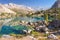 Beautiful mountain nature landscape on sunny summer day. Alaudin lake in Fann mountains, Tajikistan. Scenic with on blue water in