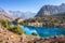 Beautiful mountain nature landscape on sunny summer day. Alaudin lake in Fann mountains, Tajikistan. Scenic with on blue water in