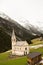 Beautiful mountain scenery in the Alps with fresh green meadows in bloom on a beautiful sunny day in springtime. Dolomiti montains