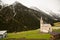 Beautiful mountain scenery in the Alps with fresh green meadows in bloom on a beautiful sunny day in springtime. Dolomiti montains