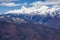 Beautiful mountain scenery of the Main Caucasian ridge with snowy peaks at winter