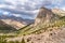 The beautiful mountain trekking road with clear blue sky and rocky hills in Fann mountains in Tajikistan