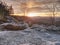 Beautiful mountain valley with a small hill peaks in sunset rays