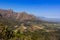 Beautiful mountainous landscape from a moving car driving on a tar road, Cape Town