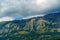 beautiful mountains and cloudy sky, summer landscape, clouds, forest on the hillsides