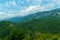 beautiful mountains, summer landscape, clouds, forest on the hillsides