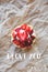 Beautiful muffin with fresh strawberries lies on the craft paper, the inscription I love you