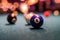 beautiful multi-colored balls with numbers lie under the light of lamps on the pool table.