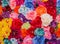 Beautiful multicolored artificial flowers background.