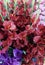 Beautiful multicolored artificial flowers on the market view