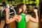 beautiful muscular fit woman exercising building muscles in fitness gym