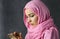 Beautiful muslim arabian woman gets text message on smartphone