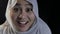 Beautiful muslim lady wearing hijab laughing and smiling, happy expression