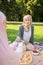 Beautiful muslim woman eating yummy lunch with friend