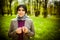 Beautiful muslim woman wearing hijab praying on rosary / tespih