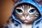 A beautiful muzzle of a cat with big eyes dressed in pajamas. Close-up. AI-generated
